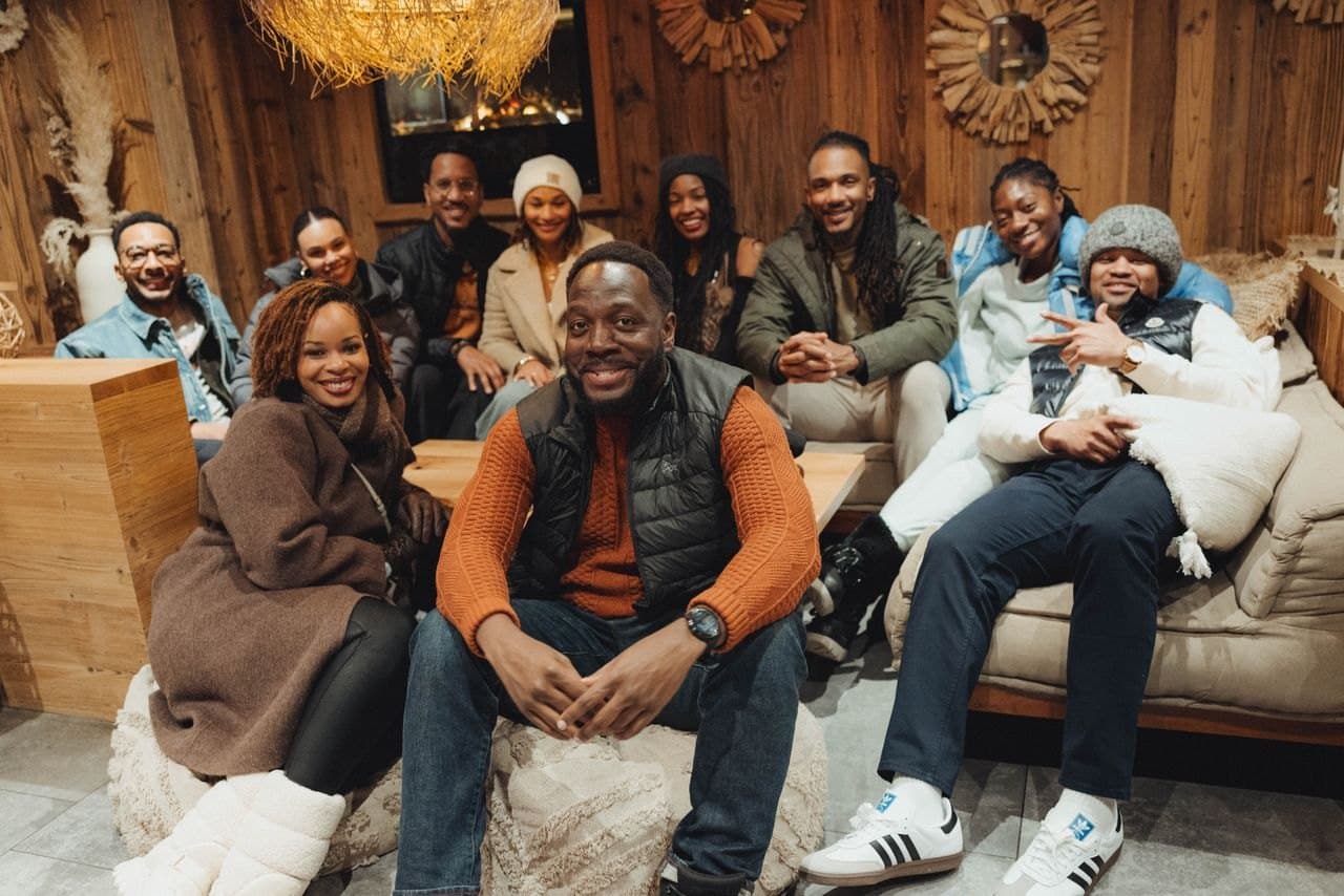 The crew hanging out together in a cozy lodge lounge
